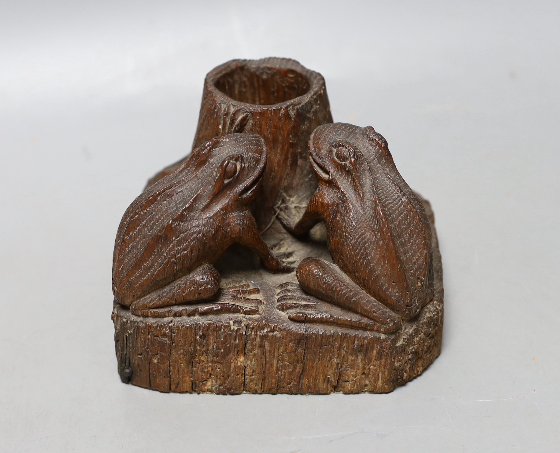 A carved oak ‘frog’ spill vase or inkwell holder, 10cm tall